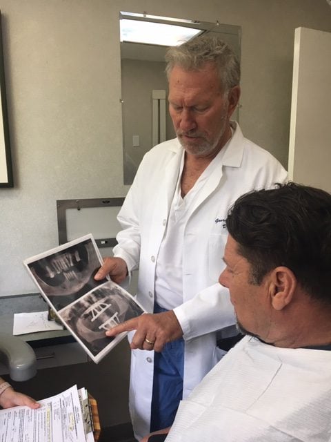 The doctor showing X-rays to a patient