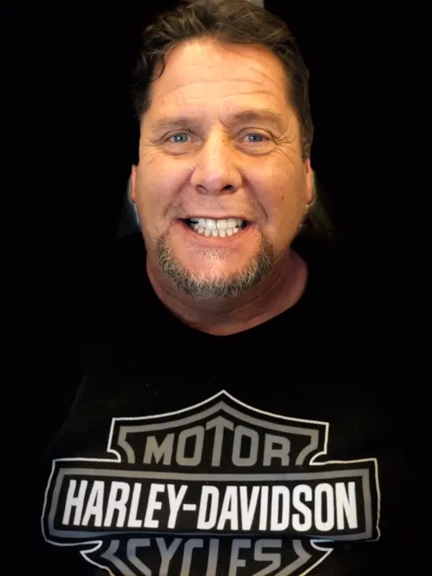 Patient smiling with healthy teeth after treatment
