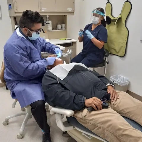 Patient receiving treatment from dentist